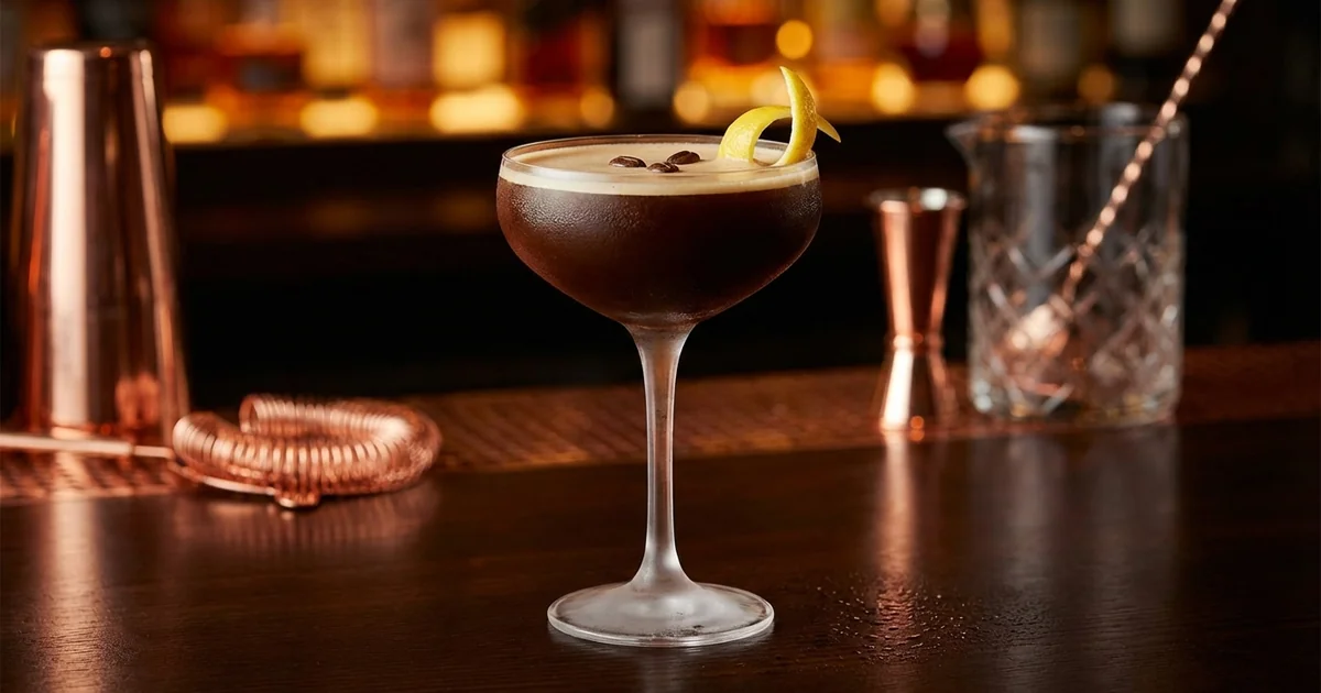 Professional photograph of a Espresso Martini cocktail with garnish in elegant bar setting